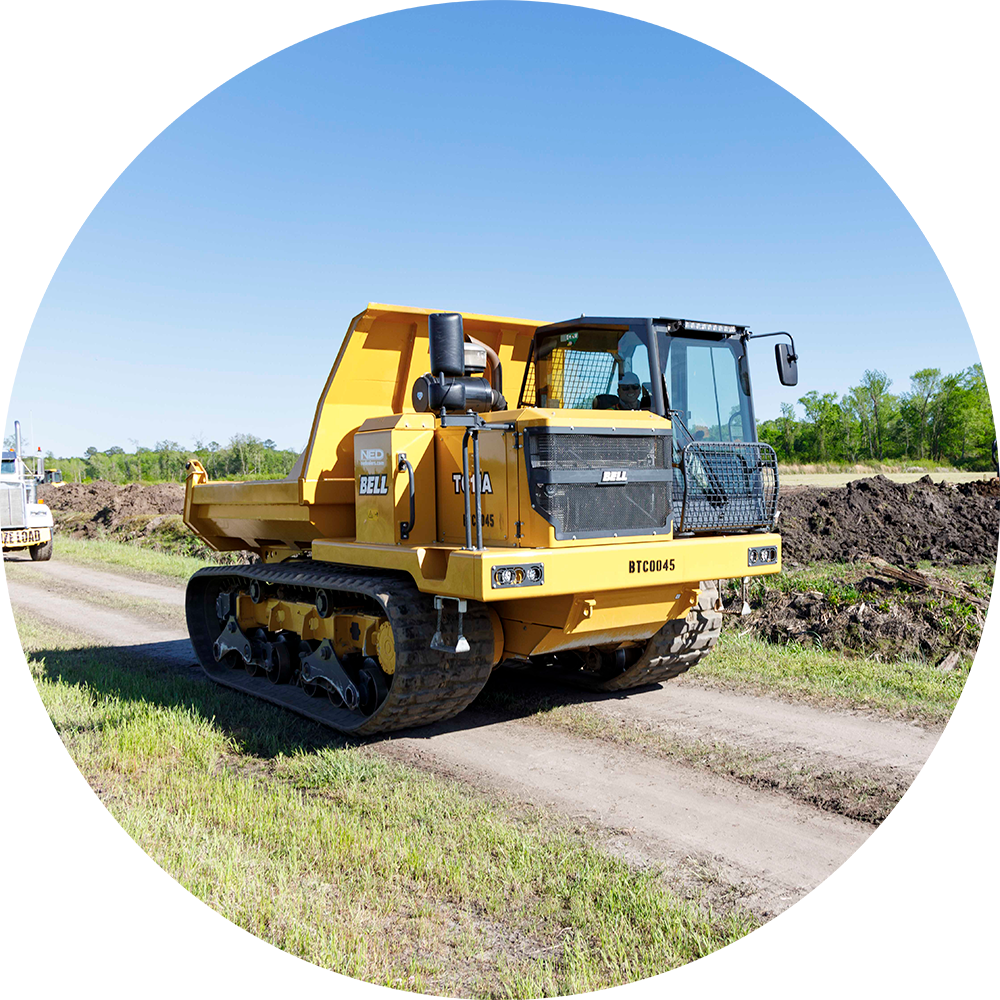 Our president, Michael, operating a 7-ton BELL TC11A Tracked Carrier at our Colonial Farms Wetland Mitigation Site in Tarboro, North Carolina