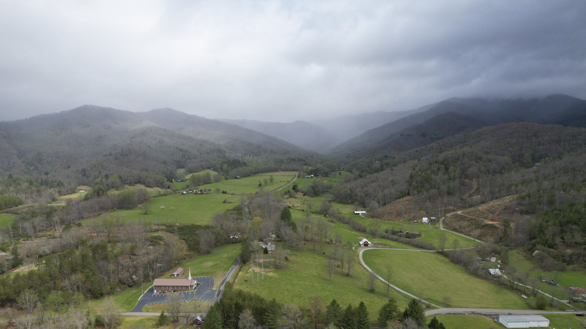 Distant drone shot at Lakey Creek mitigation site in the Little Tennessee river basin in Macon County, North Carolina at Eco Terra's project site